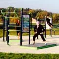 People working out on fitness equipment at Oak Grove Park