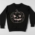 black sweatshirt with a pumpkin shape bleached onto it