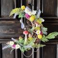 moon shaped wreath made with dried flowers and decorative mushrooms