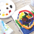 paint palate on a table with a painted canvas