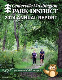 cover of the Centerville-Washington Park District 2024 Annual Report. Two people walking on a wooded nature trail.