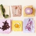 pieces of cloth with various natural materials on top that were used as natural dyes