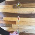 image of a sun catcher made out of colorful fused glass and mirror pieces