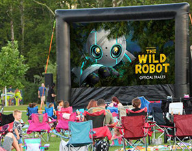 outdoor inflatable movie screen showing The Wild Robot