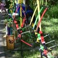 a line up of colorful bows for archery