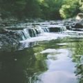 small cascade waterfall in a creek