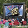 an outdoor inflatable movie screen featuring the disney pixar movie up
