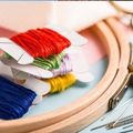 cross stitching supplies laid out on a table