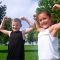 two kids flexing their arm muscles