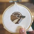 cross stitched sparrow head