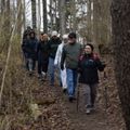 hikers being led along a path by a leader