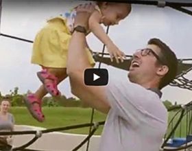 Video cover image of father and daughter on playground