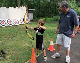 CWPD Volunteer Harry Barnes instructing archery